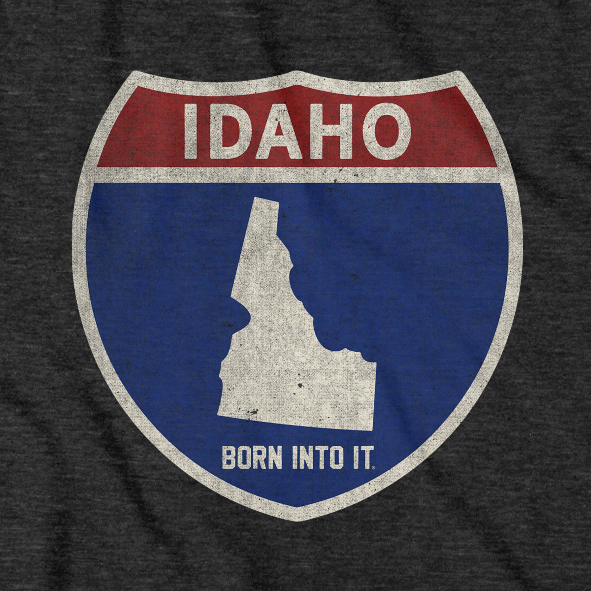 Born Into It Idaho Interstate Sign T-Shirt featuring a graphic of the iconic interstate sign on a casual T-shirt.