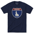 Born Into It Idaho Interstate Sign T-Shirt featuring a flat graphic of the Idaho, New York, and Utah interstate signs.
