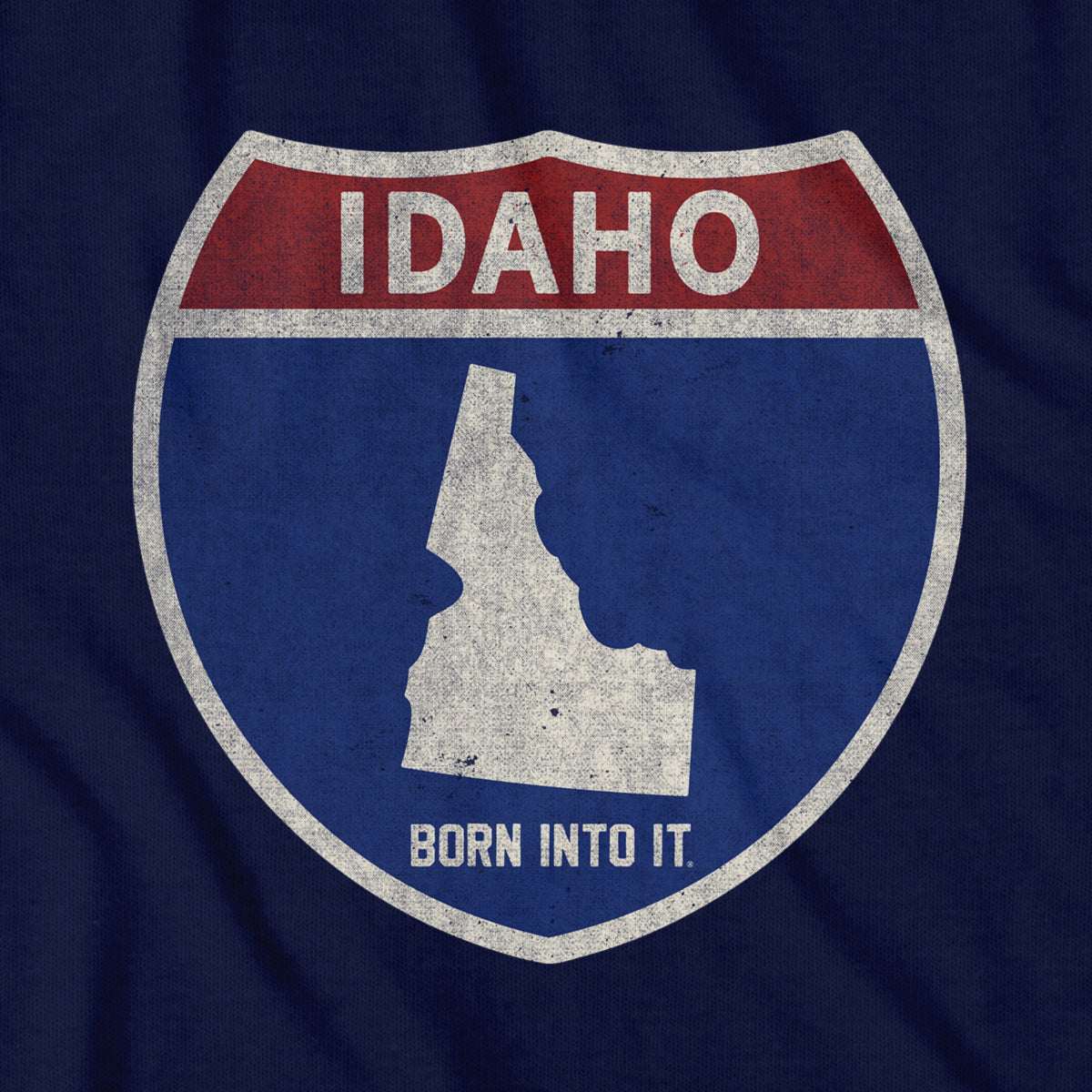 Born Into It Idaho Interstate Sign T-Shirt featuring a graphic of the Idaho state route sign.