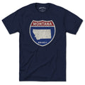 Born Into It Montana Interstate Sign T-Shirt featuring colorful highway signs for New York and Utah on a casual tee.