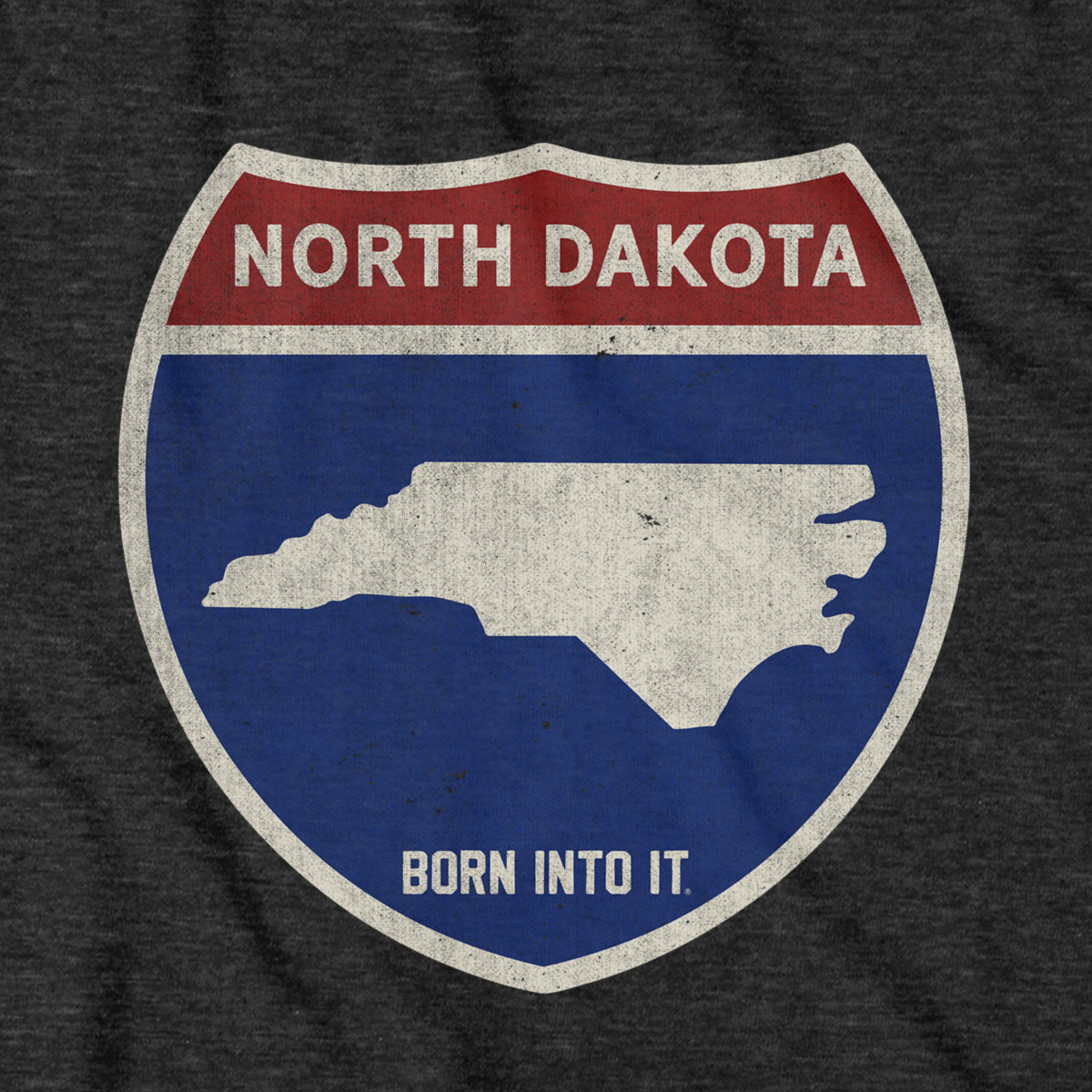 Born Into It North Dakota Interstate Sign T-Shirt with bold highway graphic and city names on soft cotton fabric.