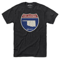 Born Into It Oklahoma Interstate Sign T-Shirt featuring a graphic of the Oklahoma highway sign on a flat front view.