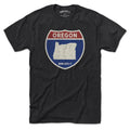 Born Into It Oregon Interstate Sign T-Shirt featuring a graphic of a highway interstate sign on a flat background.