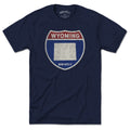 Born Into It Wyoming Interstate Sign T-Shirt featuring a vintage-style map and highway signs on soft cotton fabric.